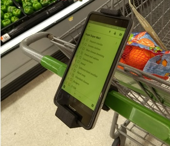 Shopping cart phone holder